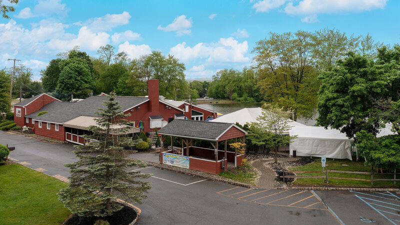 Outdoor dining area and view of restaurant building
